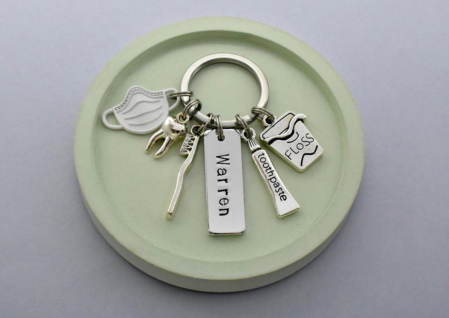 Keychain with dental-themed charms with personalised tag