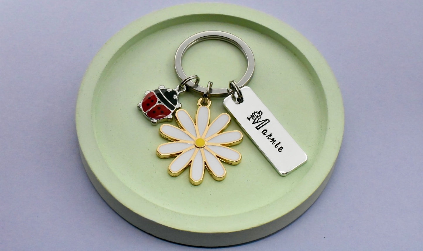 Keychain with flower and ladybug charm 