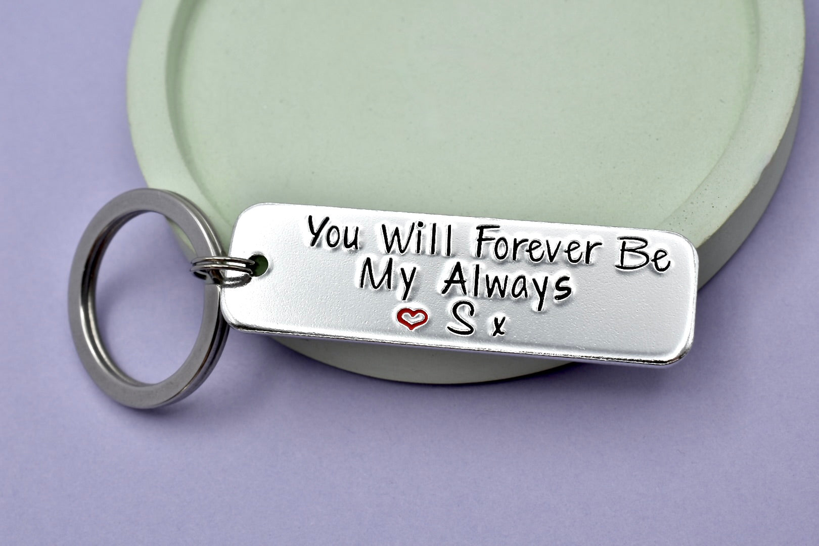 Silver rectangle keyring, hand stamped with the text "You Will Forever Be My Always" with red heart design and personalised initial.