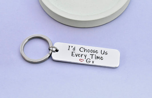 Aluminium keyring hand stamped with "I'd choose us every time" and red heart with personalised initial 