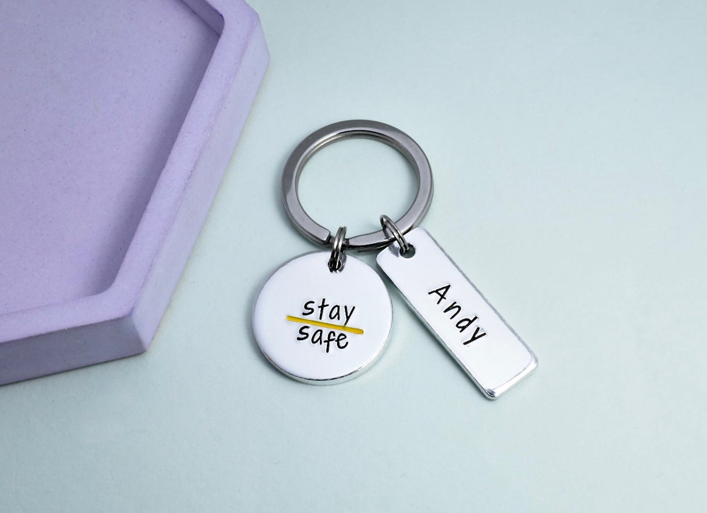 Thin Yellow Coast Guard Keyring. silver disc is stamped with yellow line and stay safe. rectangle is personalised with recipients name