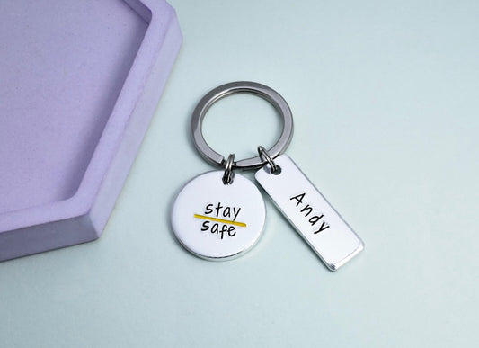 Thin Yellow Coast Guard Keyring. silver disc is stamped with yellow line and stay safe. rectangle is personalised with recipients name